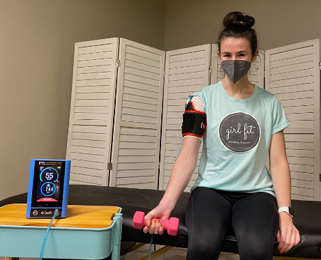 Blood flow restriction with a bicep curl at Girl Fit Physical Therapy